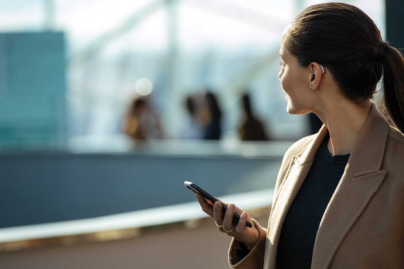 Woman holding cellphone Woman holding cellphone